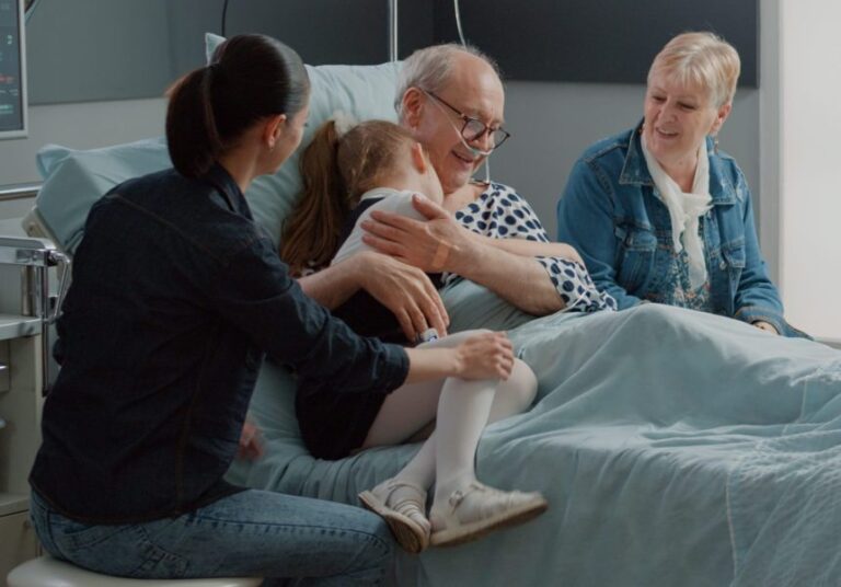 child-hugging-sick-grandpa-hospital-ward-bed-visit-comforting-aged-patient-with-illness-kid-mother-visiting-senior-man-with-iv-drip-bag-nasal-oxygen-tube-visitors-clinic-2048x1428-1-860x600