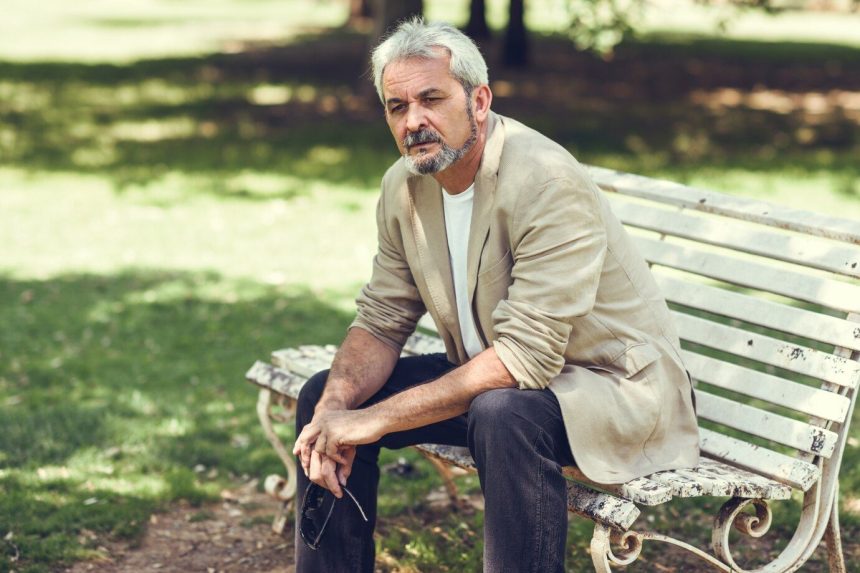 pensive-mature-man-sitting-bench-urban-park_1139-1108-860x573