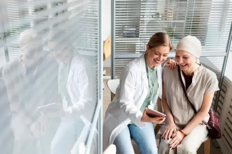middle-aged-woman-with-skin-cancer-talking-with-her-doctor_23-2148988520-860x573